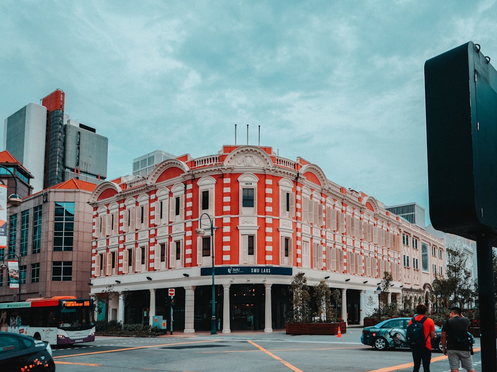 two person walking near building