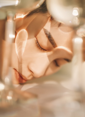 Natural glowing women's face with closed eyes