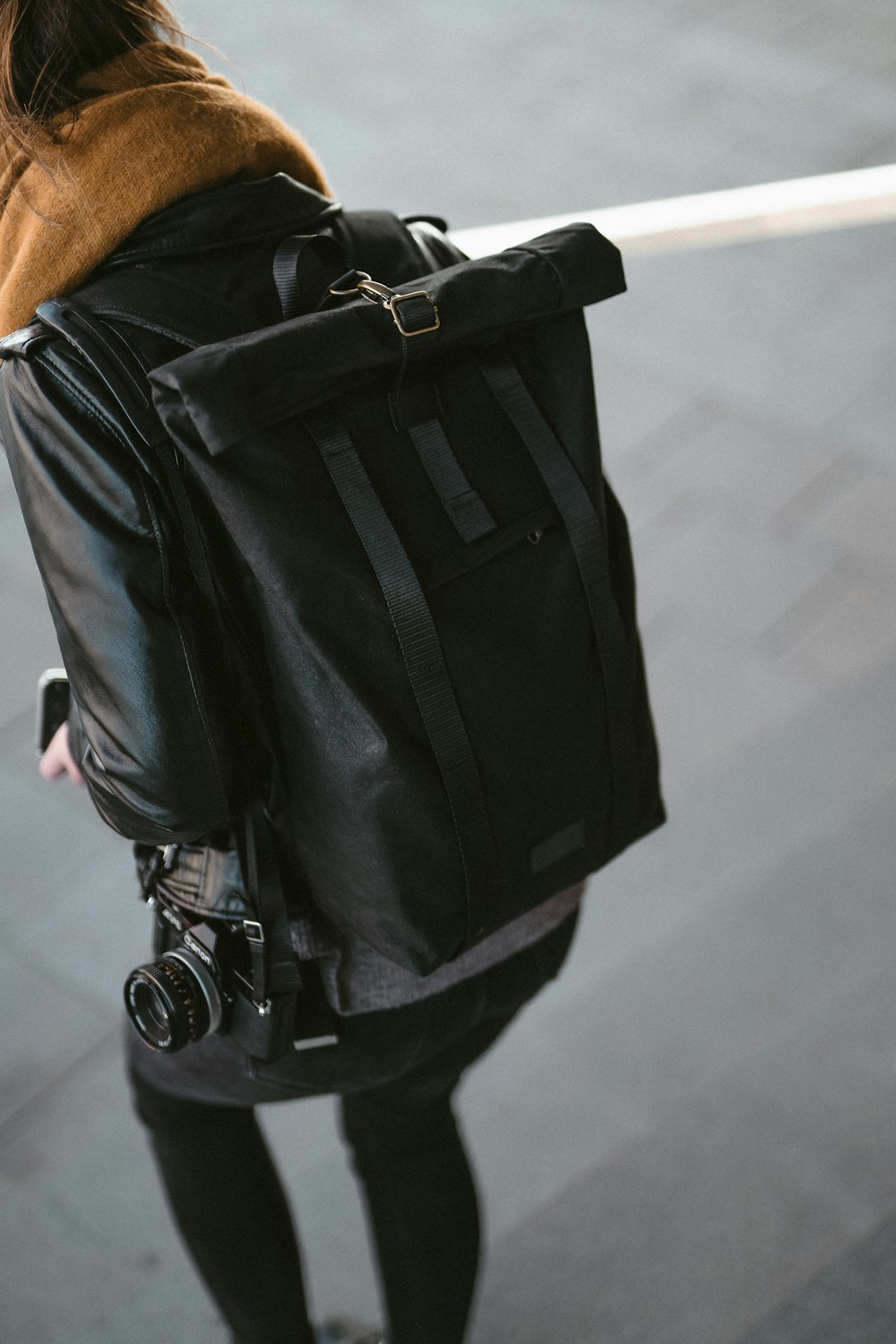 black backpack and DSLR camera