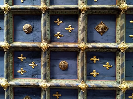 Elegant blue and gold Masonic symbols on a classic architectural background.