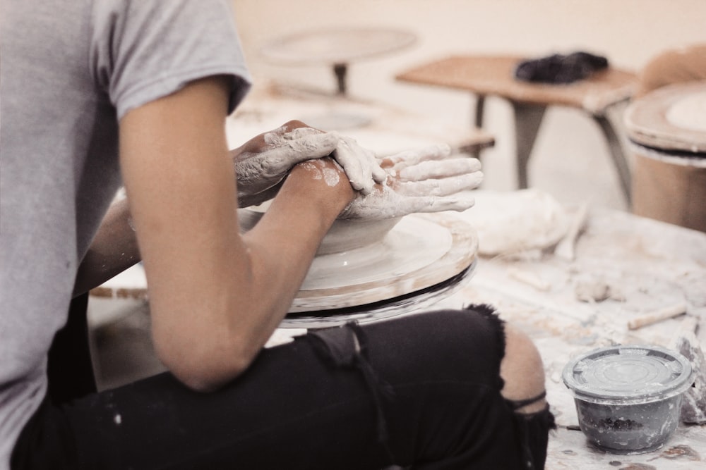 man making clay pot