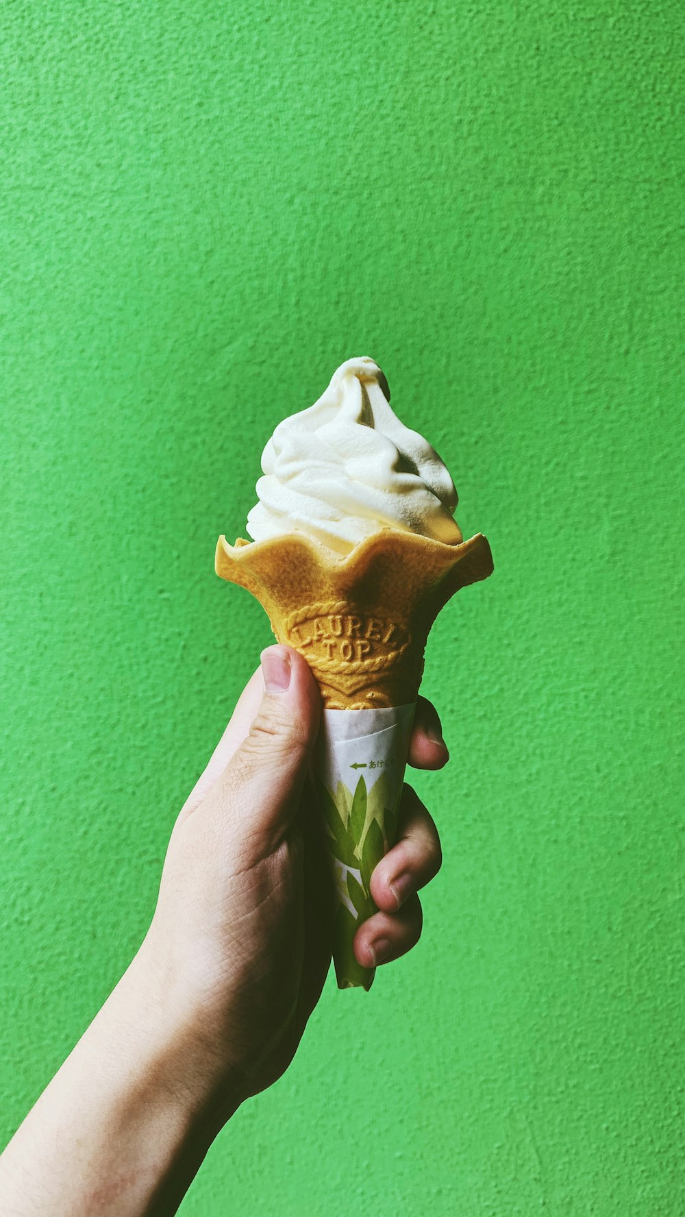 person holding ice cream cone