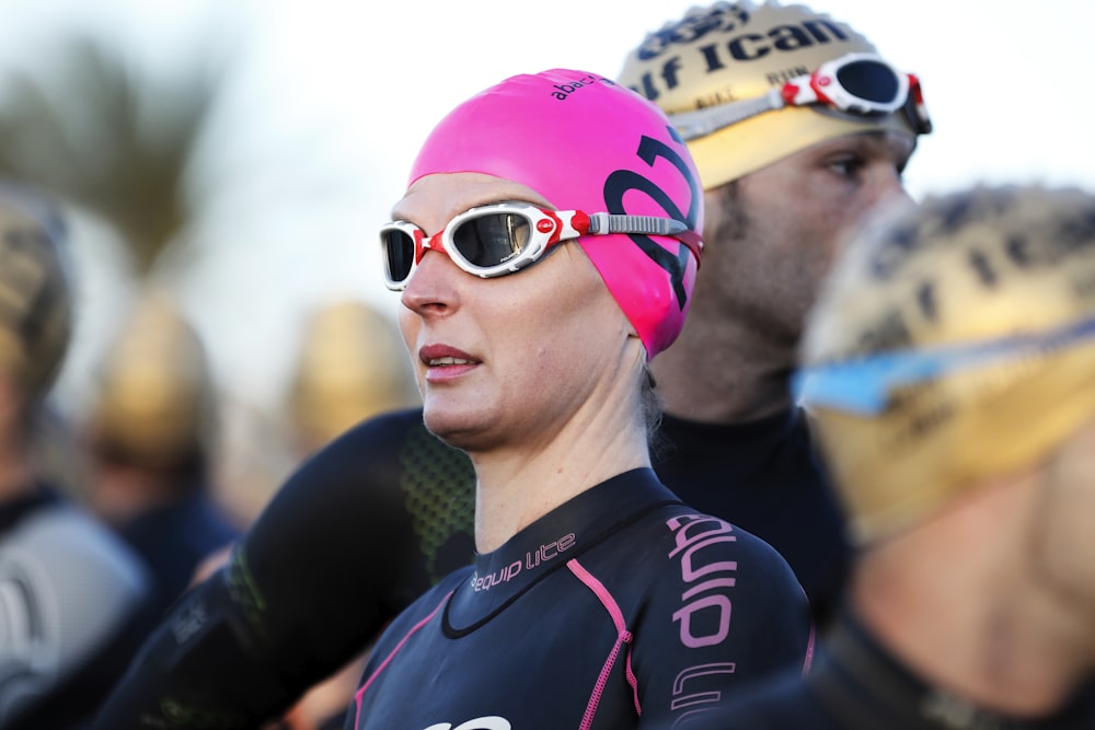 selective focus photography of woman wearing swimming cap