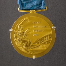 round gold-colored medal