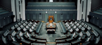 tables and chairs inside the hall