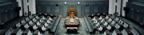 tables and chairs inside the hall