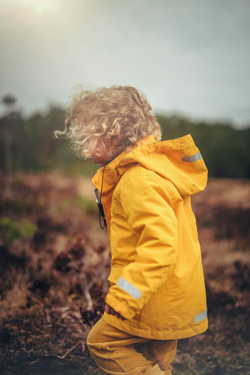 child wearing yellow jacket