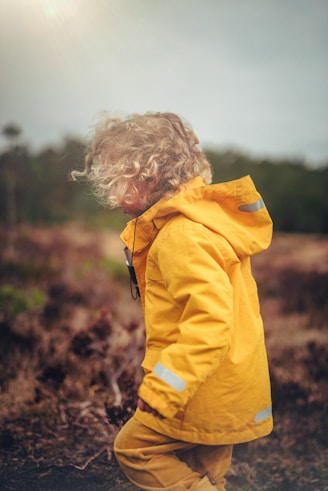 child wearing yellow jacket