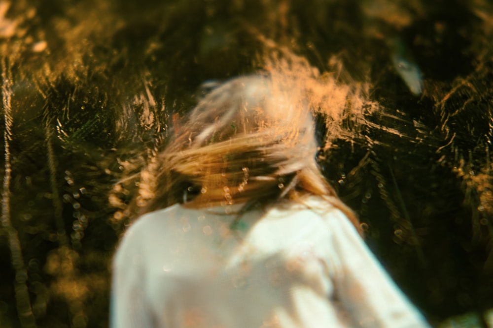 woman standing wearing white shirt