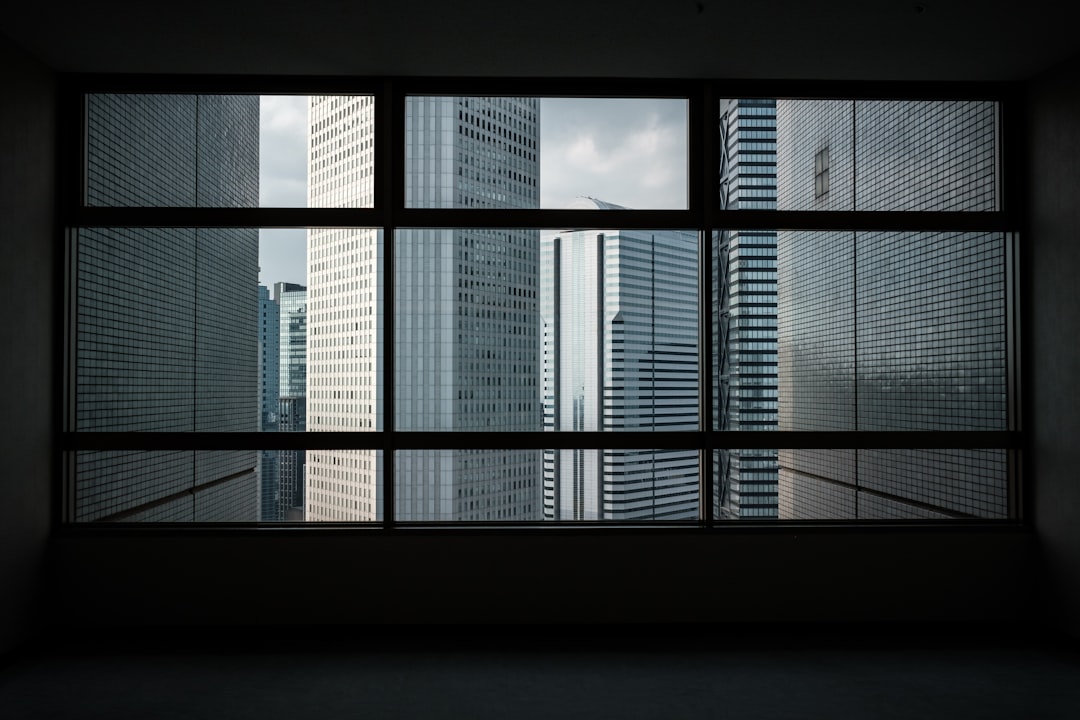 view of high-rise buildings through glass window