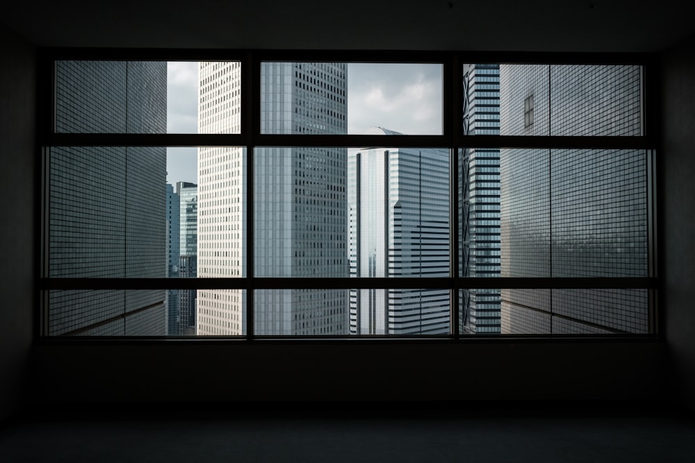 view of high-rise buildings through glass window