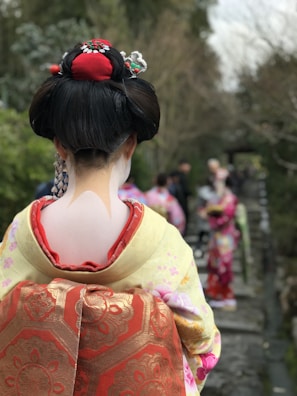 An anime girl wearing a traditional kimono with floral patterns.