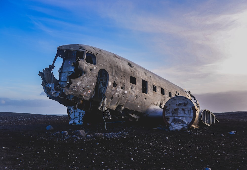 gray plane at brown field