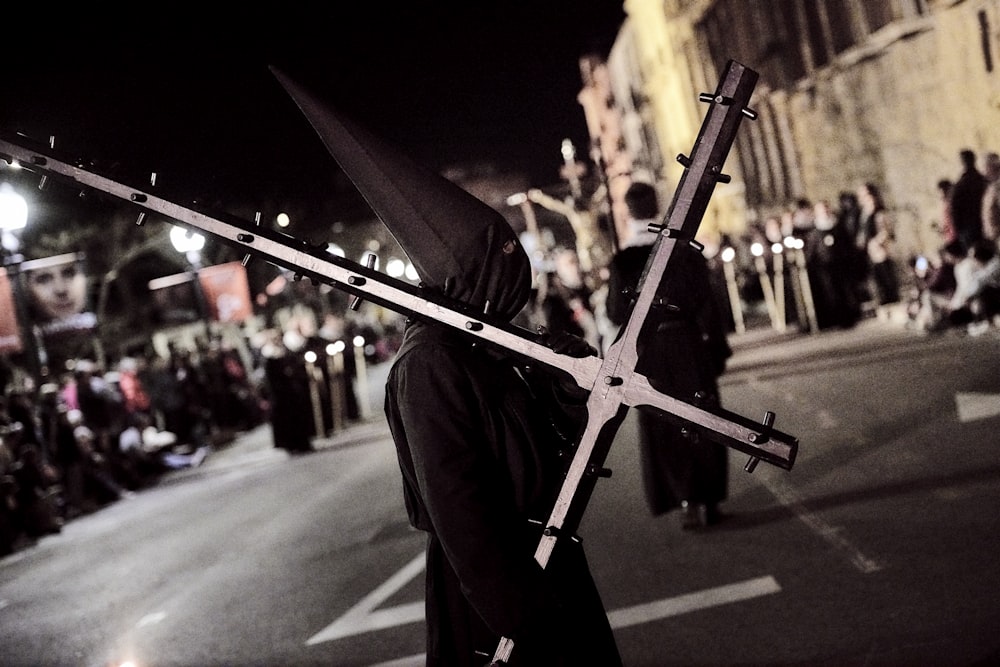 man carrying cross