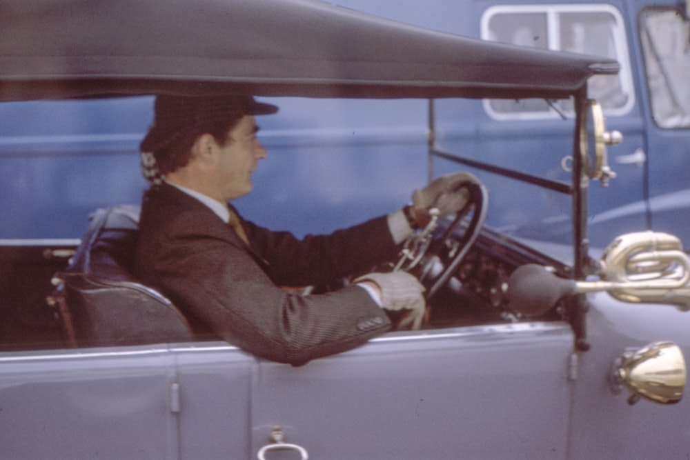 men ridding a car during daytime