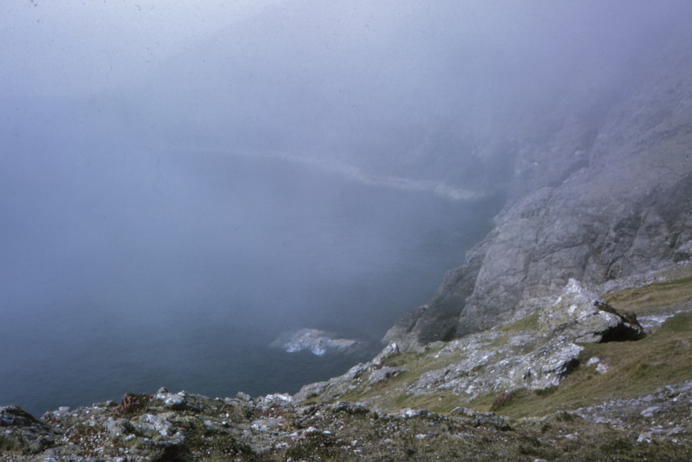 gray rocky mountain with fog