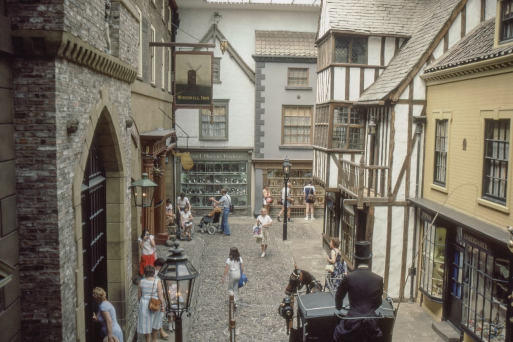 people walking near houses