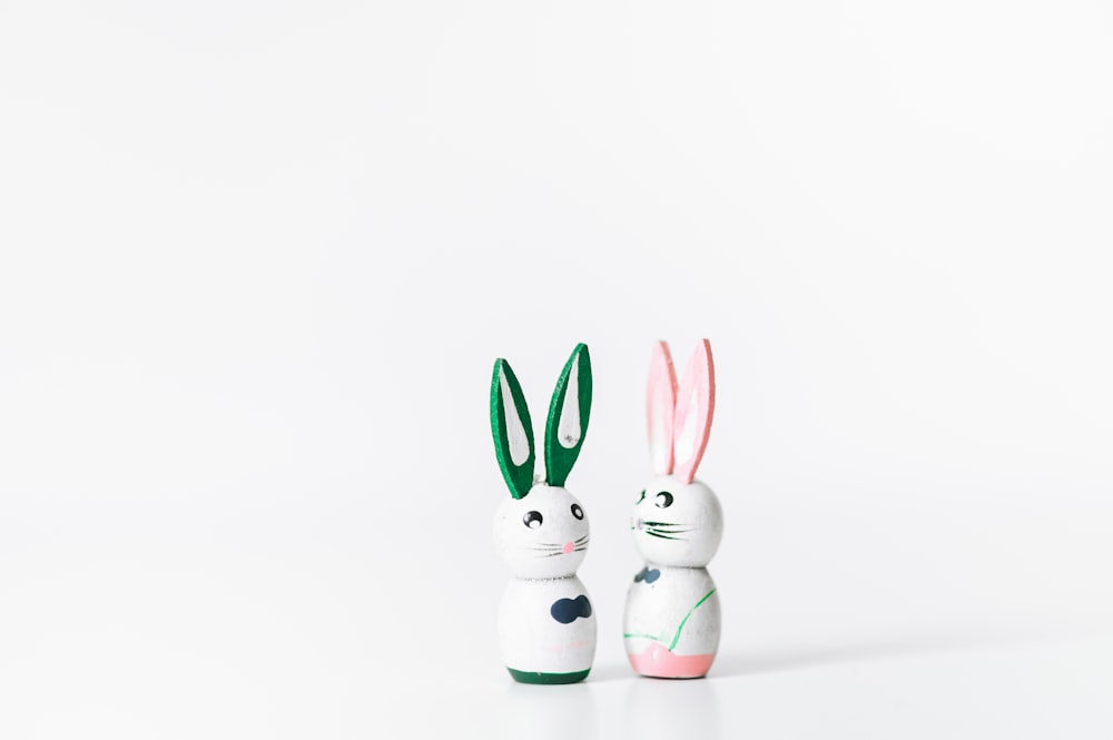 two rabbit figurines