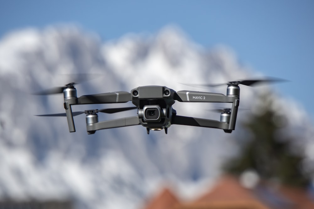 grey Mavic 3 drone in flight