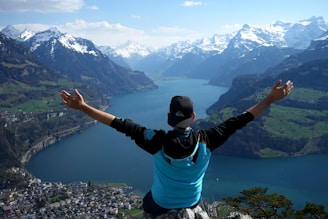 man on top of mountain