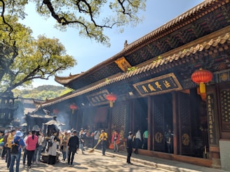 Photo of the temple courtyard with worshippers during a traditional ceremony at Xingnan Temple.