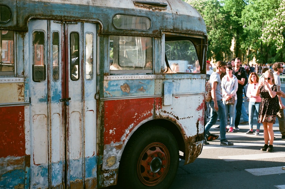 group of people standing near vehicle