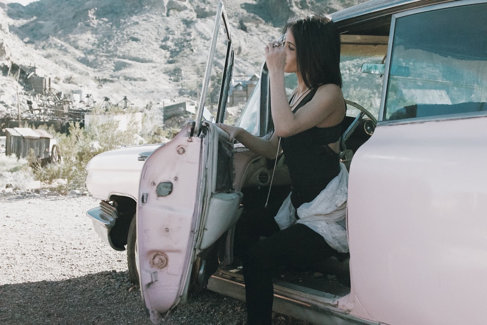 woman sitting inside vehicle