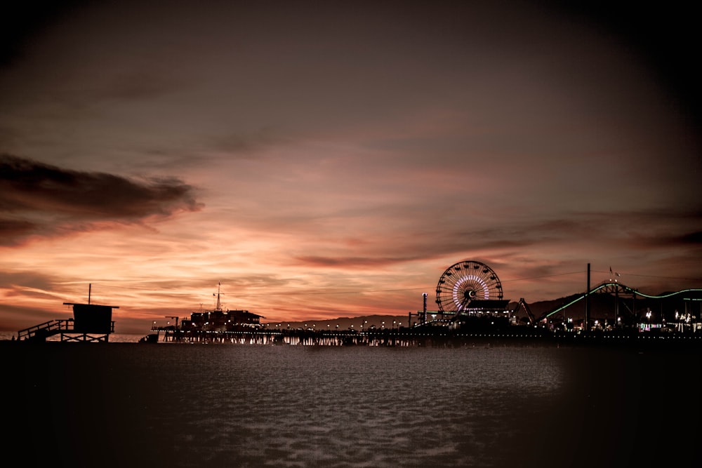 silhouette photography of amusement park during golden hour