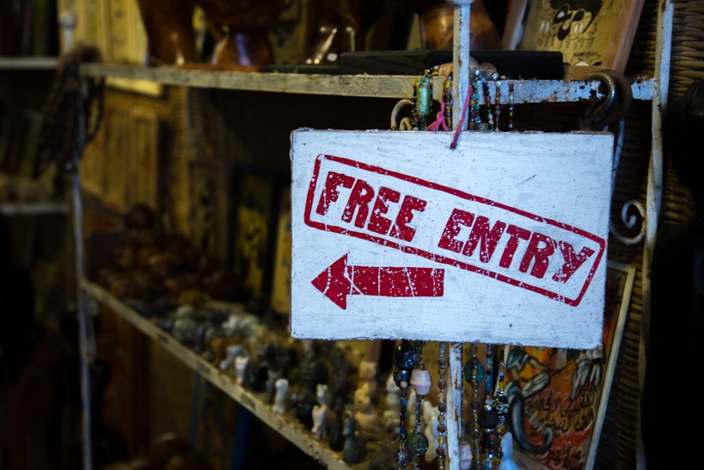 white and red Free Entry signage