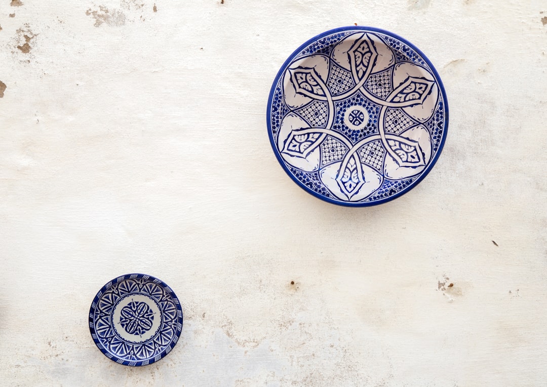 two white-and-blue ceramic dinnerware,