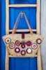 brown leather tote bag hanging on wall