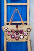 brown leather tote bag hanging on wall
