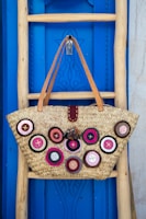 brown leather tote bag hanging on wall