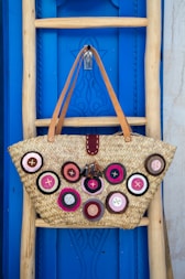 brown leather tote bag hanging on wall