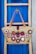 brown leather tote bag hanging on wall