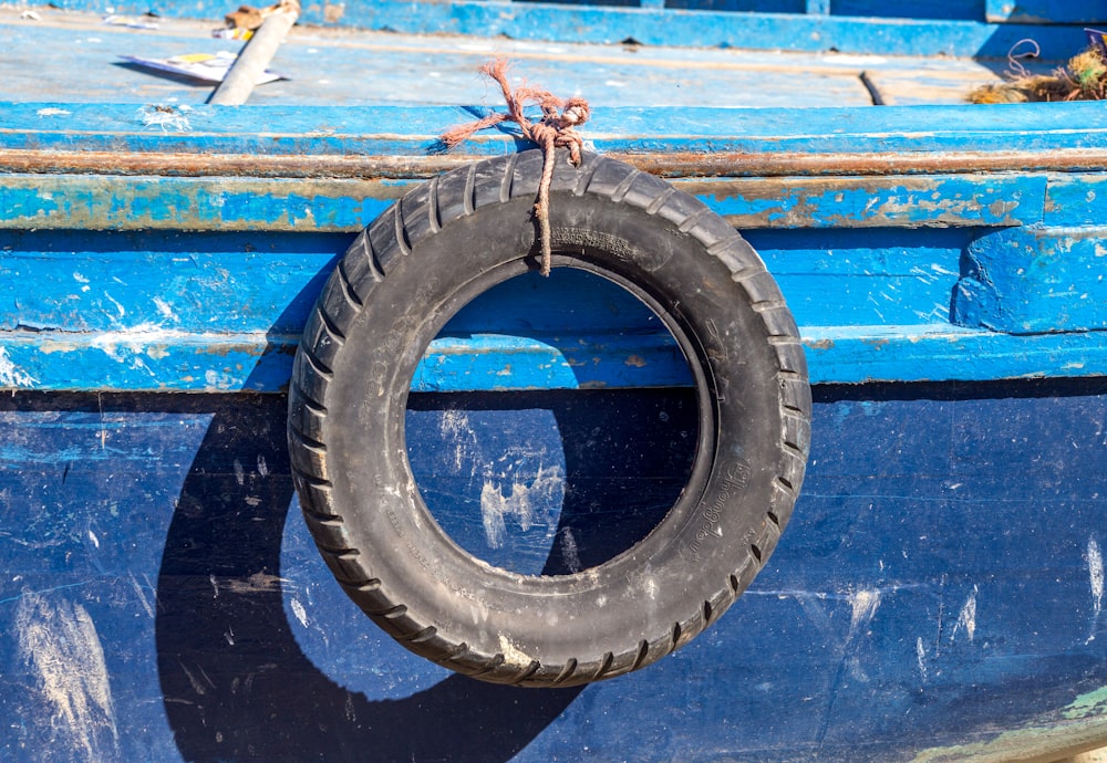 vehicle tire tied on boat