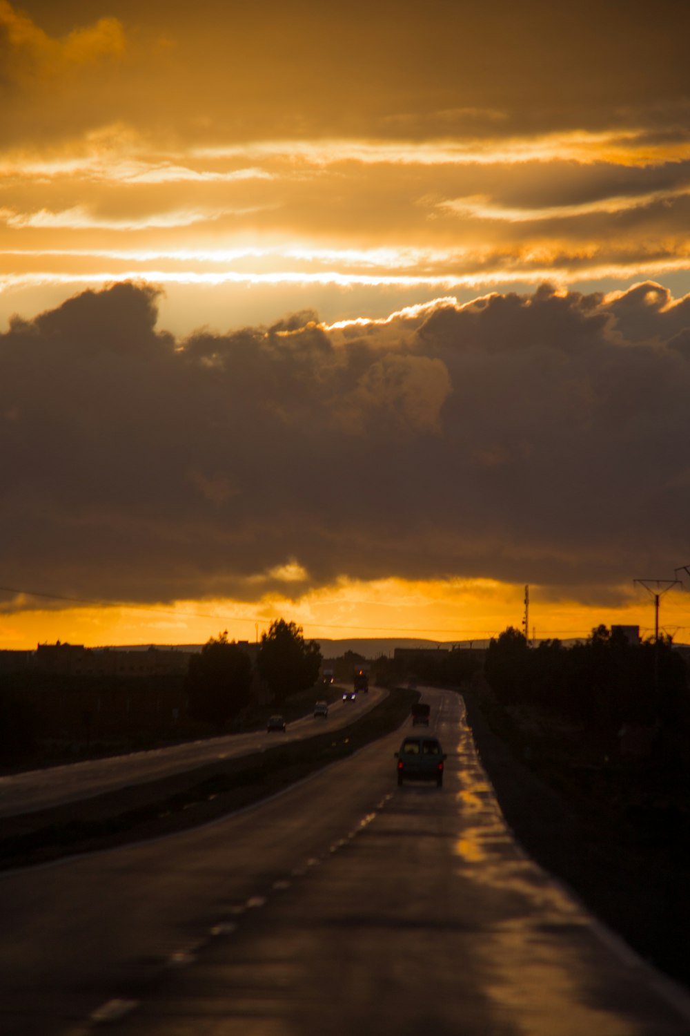 cars on road durig golden hour