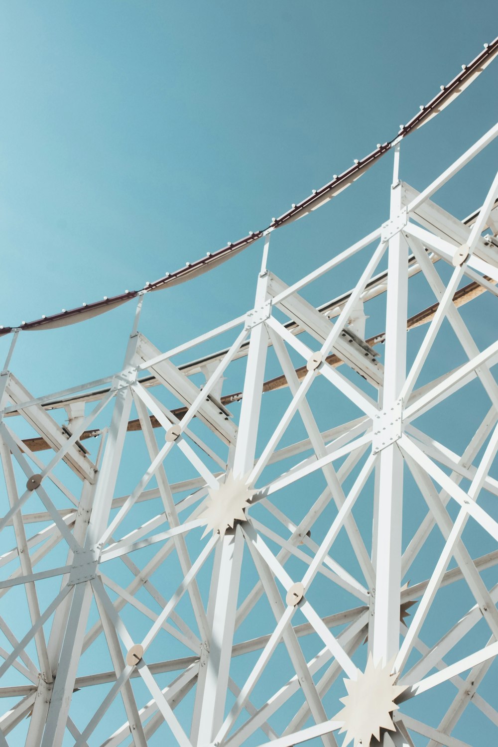 white metal frames under blue sky