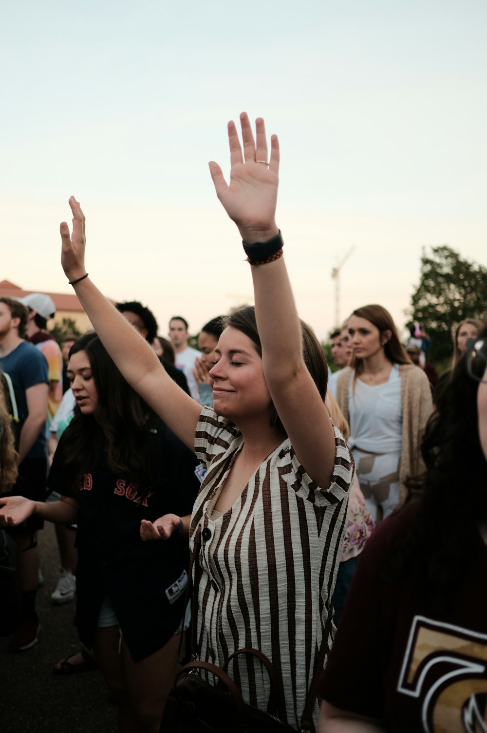 woman raising her both hands