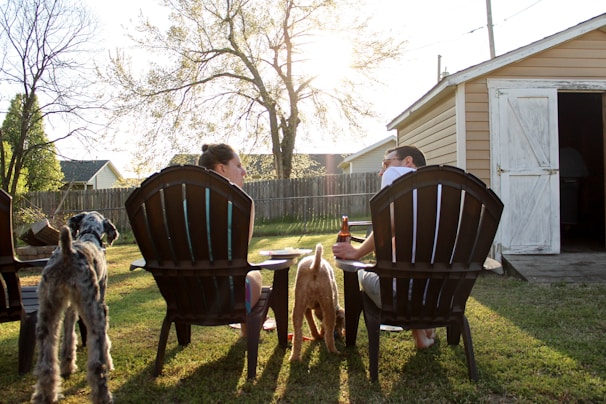 man and woman sitting on chairs