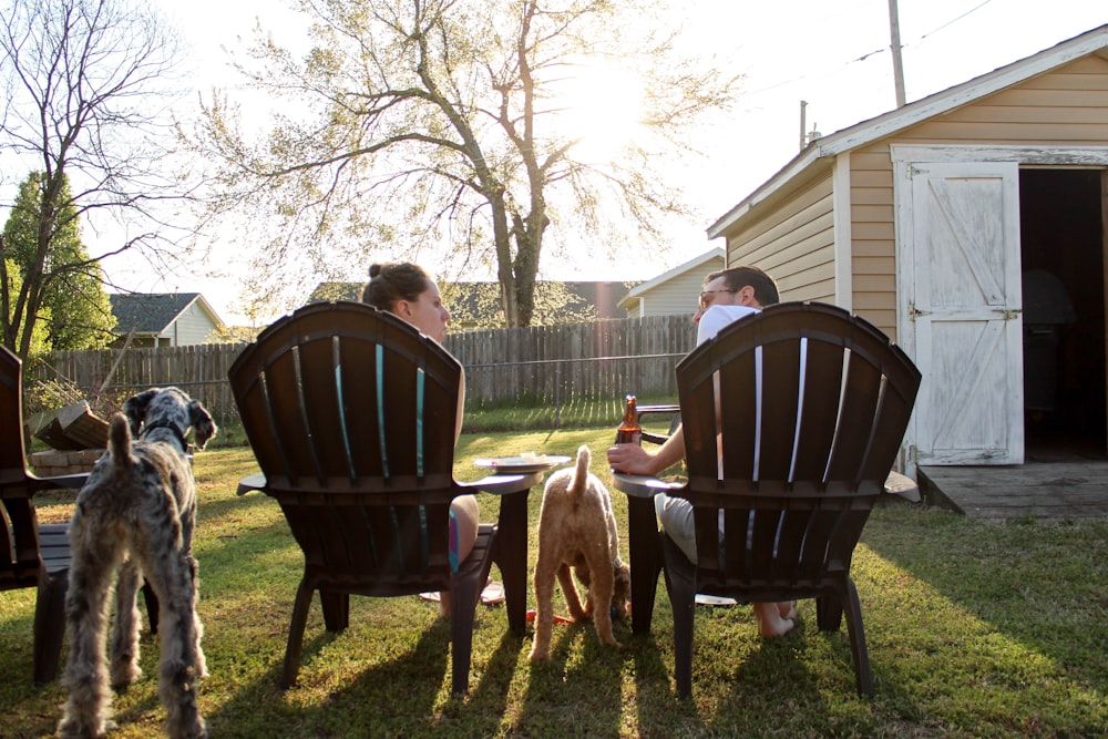 man and woman sitting on chairs