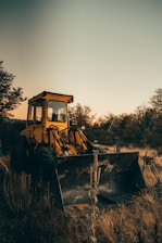 yellow bulldozer on field