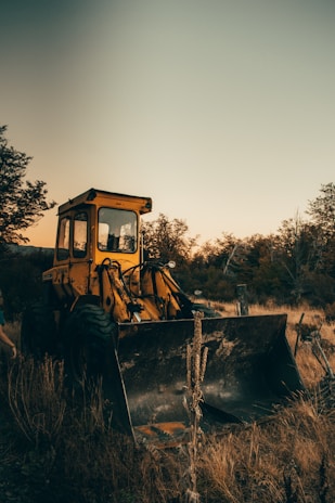 yellow bulldozer on field