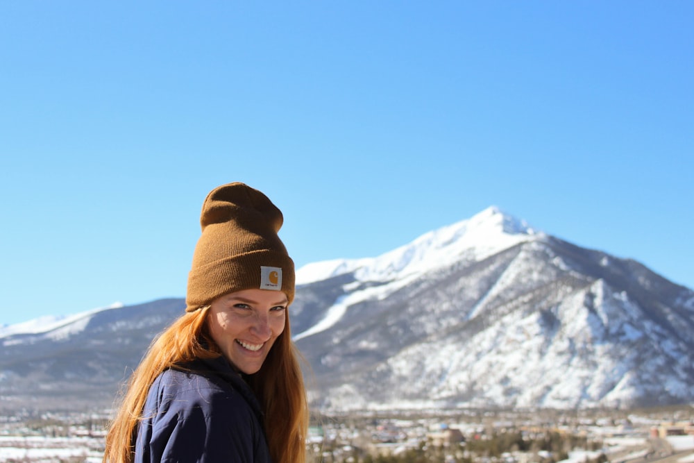 woman near white snow cape mountain