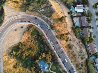 Aerial view of a smoothly paved roadway winding through a San Antonio neighborhood.