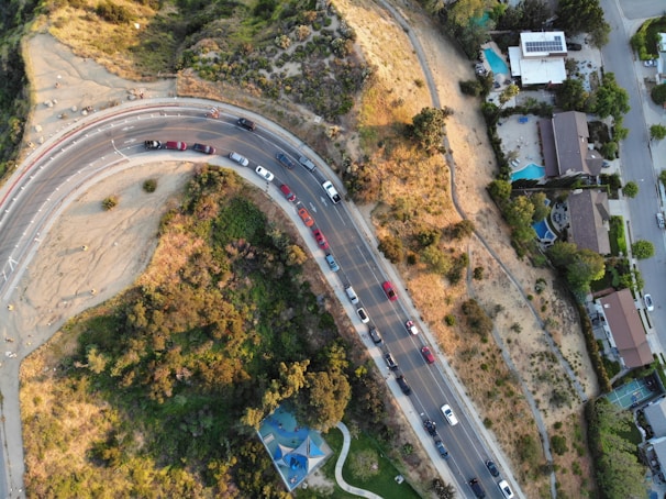 Aerial view of a smoothly paved roadway winding through a San Antonio neighborhood.