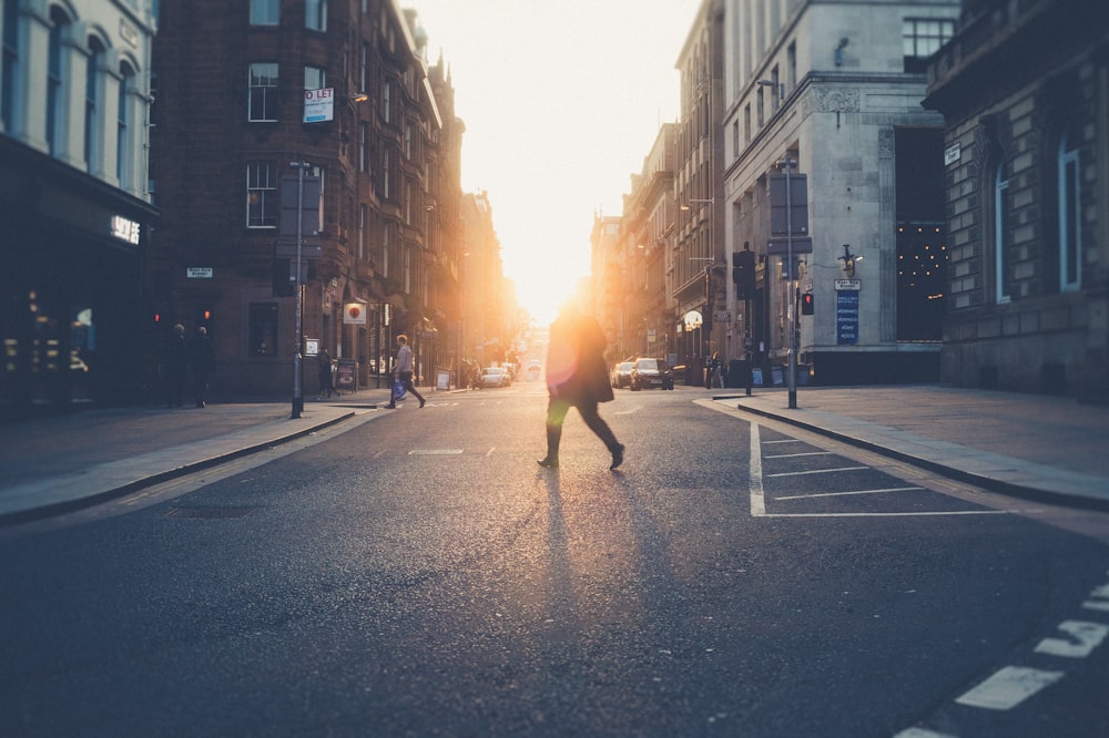 person across road during golden hour