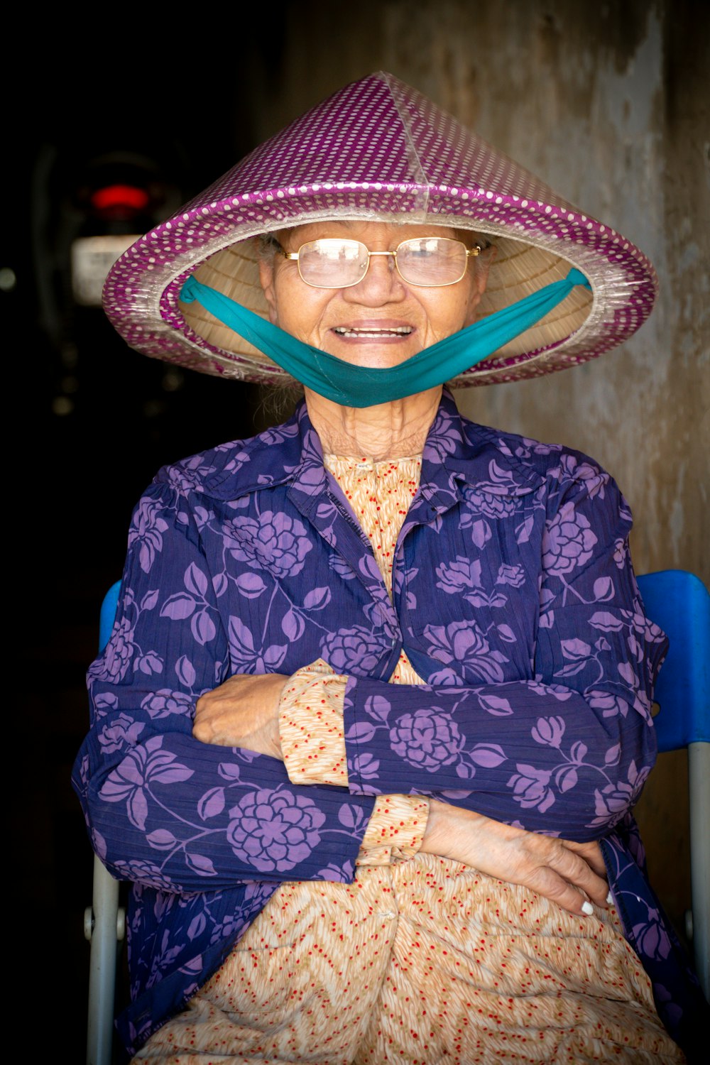 women's blue and gray floral top and purple hat