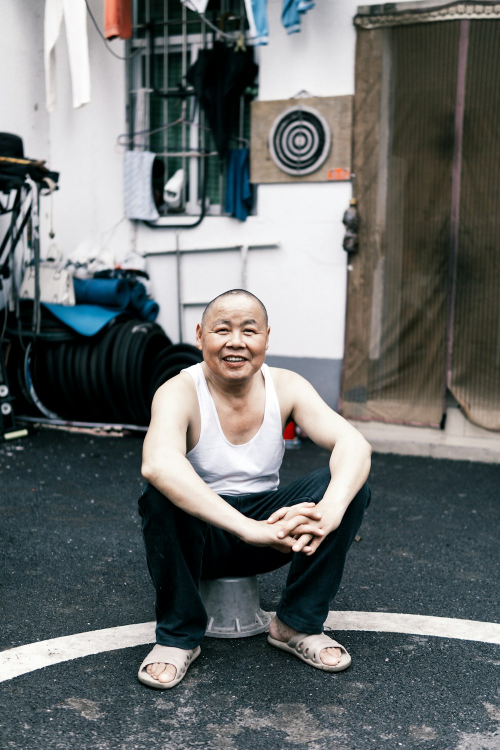 man sitting on bucket