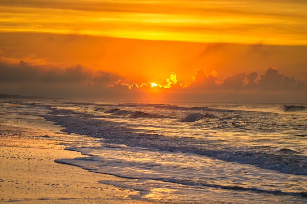 seashore and calm sea under sunset view